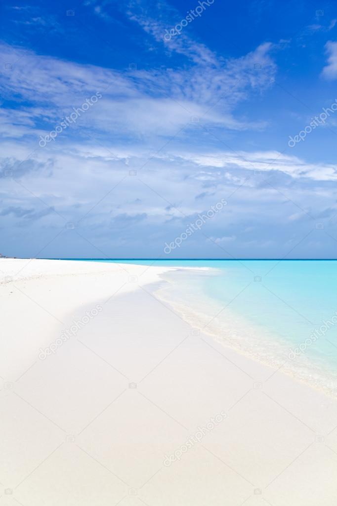 Beautiful tropical beach. White sand beach, blue sky, white clouds