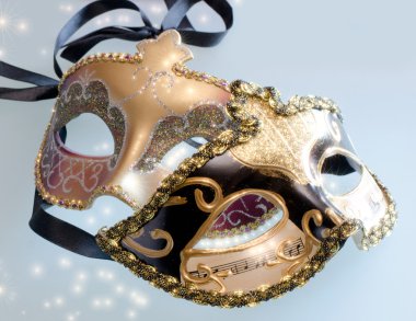 Venice carnival masks with shining stars clipart