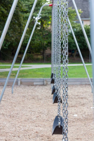 Playground swings — Stock Photo, Image