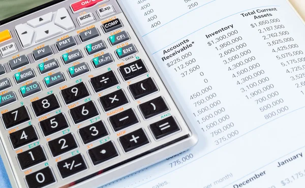 Calculator and book — Stock Photo, Image