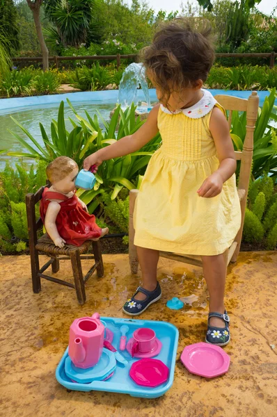 Tea for her doll — Stock Photo, Image