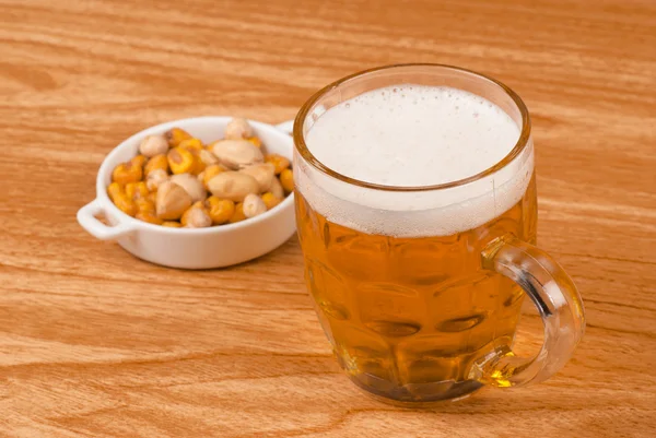 Beer with assorted nuts — Stock Photo, Image