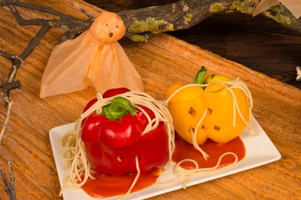 Fake pumpkins with pasta worms — Stock Photo, Image