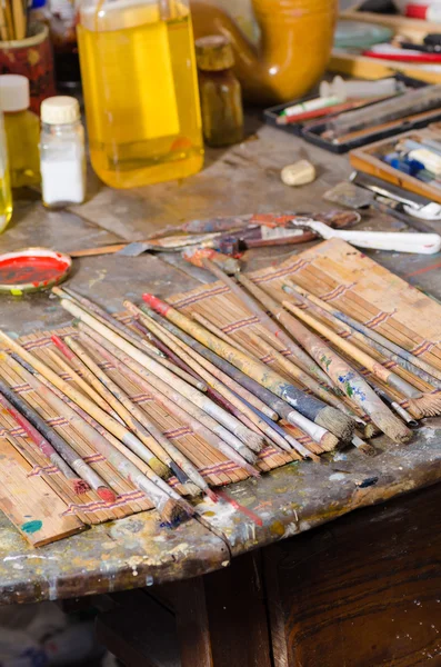 Paintbrushes in an atelier — Stock Photo, Image