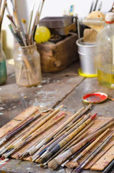 Paintbrushes in an atelier — Stock Photo, Image