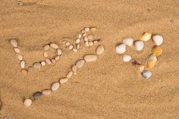 Liefde bericht op zand — Stockfoto