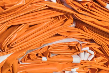 Folded Tarpaulin in Orange clipart