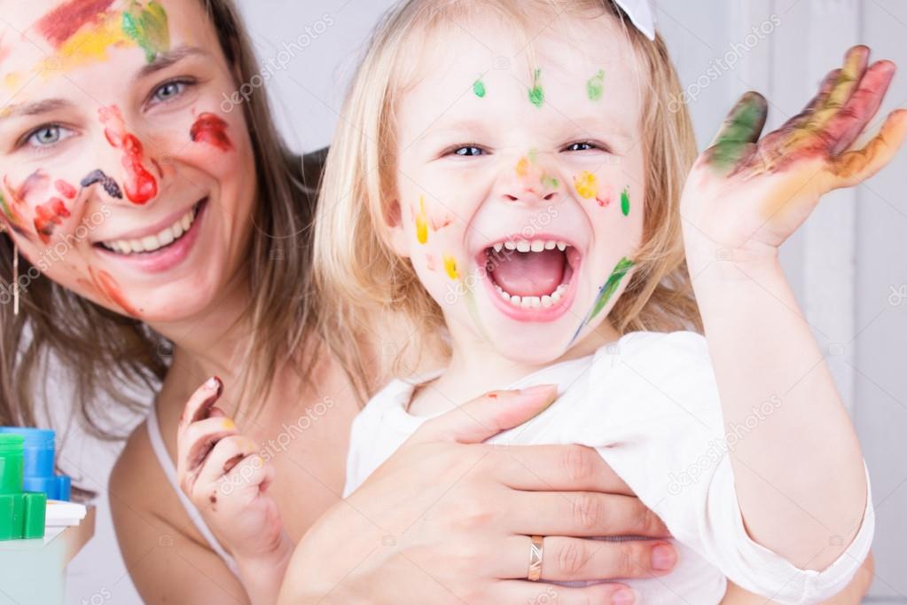 Mother and daughter with paint on faces