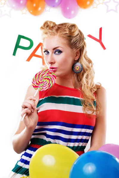 Pinup meisje met lolly, baloons en partij woord — Stockfoto