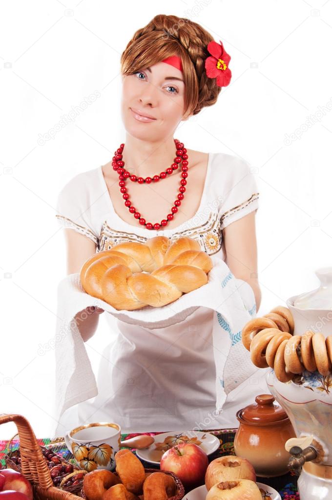 Hospitable russian woman offering traditional loaf