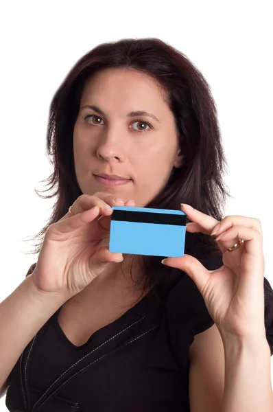 Serious woman holding blue credit card — Stock Photo, Image