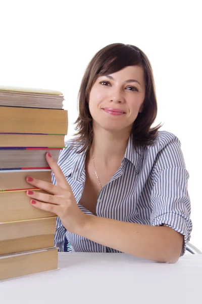 Student girl sitting with pile of books Stock Image