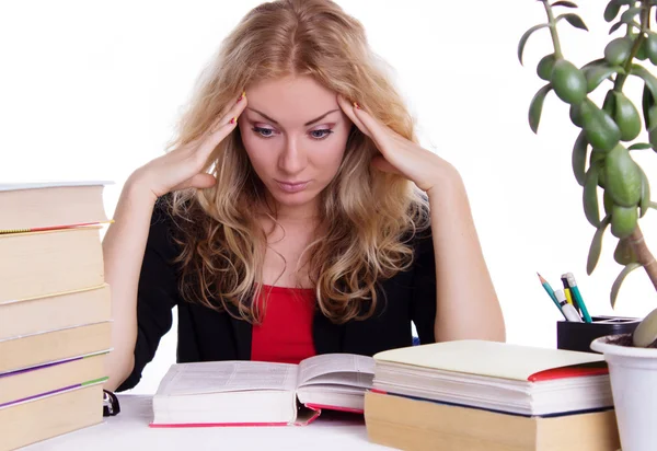 Stressed student girl with pile of books isolated Royalty Free Stock Photos