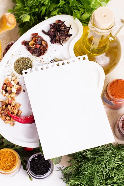 Blank notebook sheet with spices and herbs — Stock Photo, Image