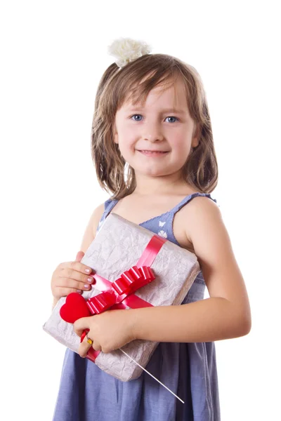 Smiling little girl holding present box — Stock Photo, Image