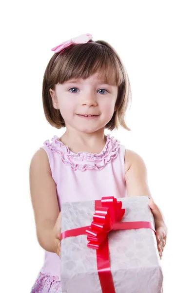 Smiling little girl holding present box — Stock Photo, Image