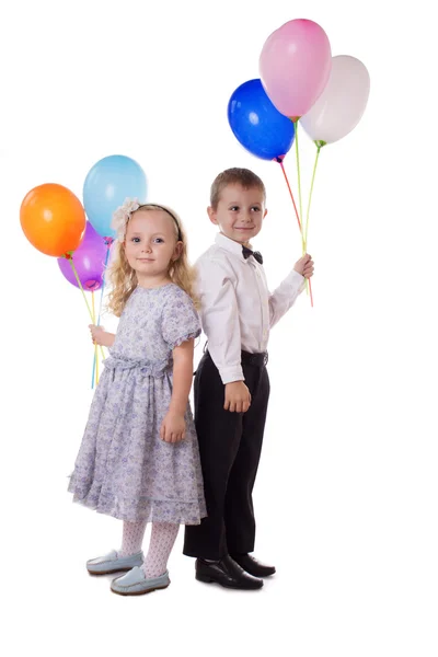 Sweet boy and girl with colorful balloons Stock Image