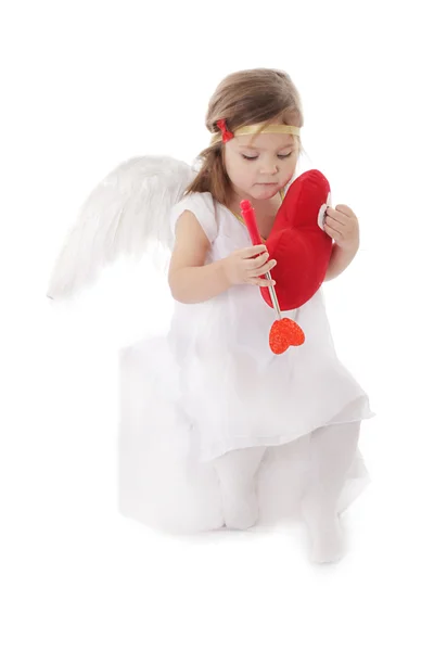 Triest cupid meisje zit met hart — Stockfoto