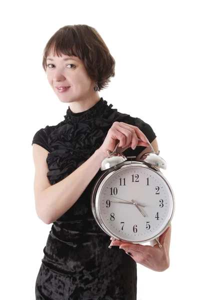 Brunette woman in dress holding clock — Stock Photo, Image