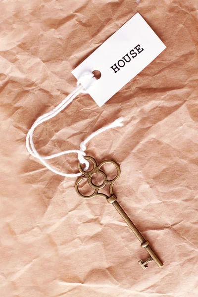 Vintage key with house word