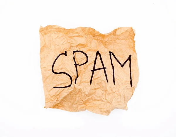 Crumpled paper with the word SPAM. — Stock Photo, Image
