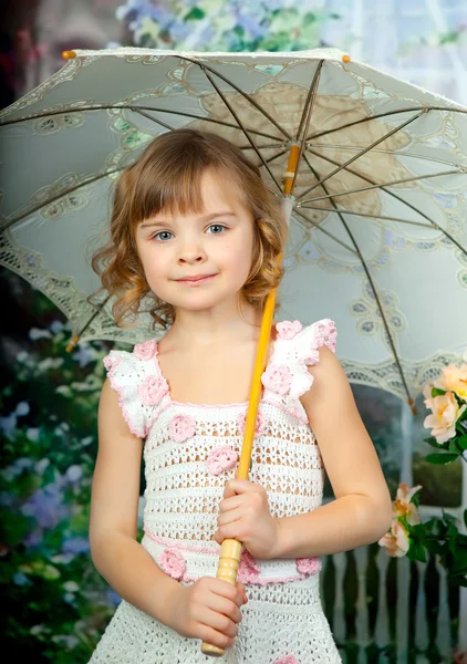 Portrait of a pretty girl with an openwork knitted dress umbrell — Stock Photo, Image