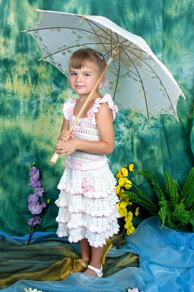 Pretty girl with an openwork knitted dress umbrella — Stock Photo, Image