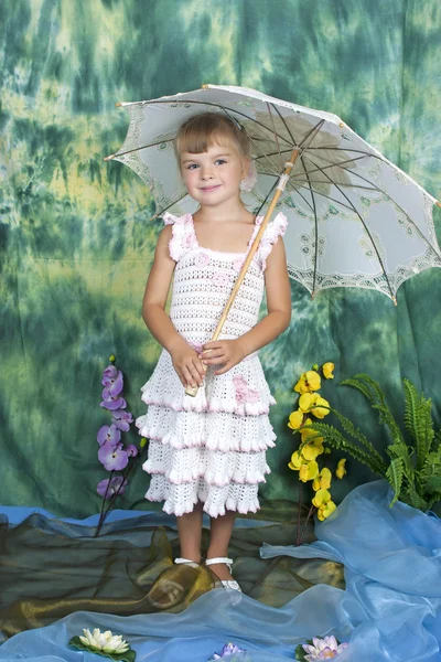 Pretty girl with an openwork knitted dress umbrella — Stock Photo, Image