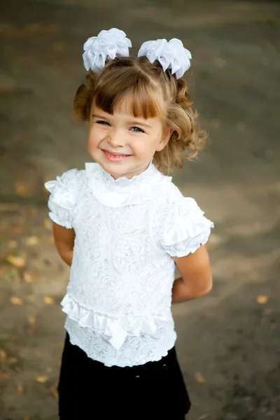 Portrait first grader girl in school uniform outside — Stock Photo, Image