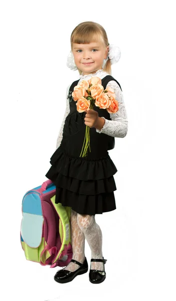 Studentka ve školní uniformě s kyticí květin a vtipem — Stock fotografie
