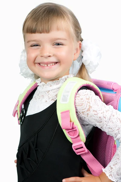 První grader dívka ve školní uniformě s batohem — Stock fotografie