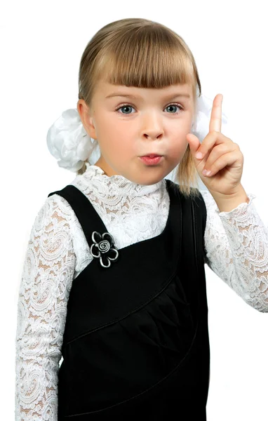 Portrait of First grader girl in school uniform on a white backg — Stock Photo, Image