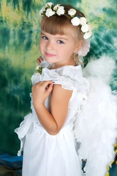 Cute girl with angel wings and a white dress Royalty Free Stock Images