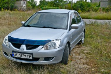 Ukrayna, Novomoskovsk şehri 09 / 04 / 2022. Mitsubishi Lancer 2000 'den 2007' ye kadar Japonya 'daki Mizushima fabrikasında 9 nesil üretildi..