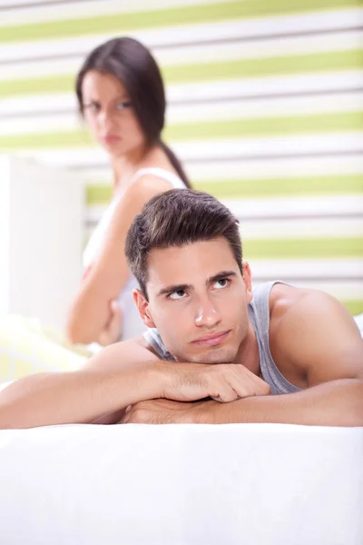 Couple having an argument in bedroom Stock Photo