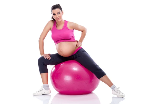 Gravid kvinna stretching benen — Stockfoto