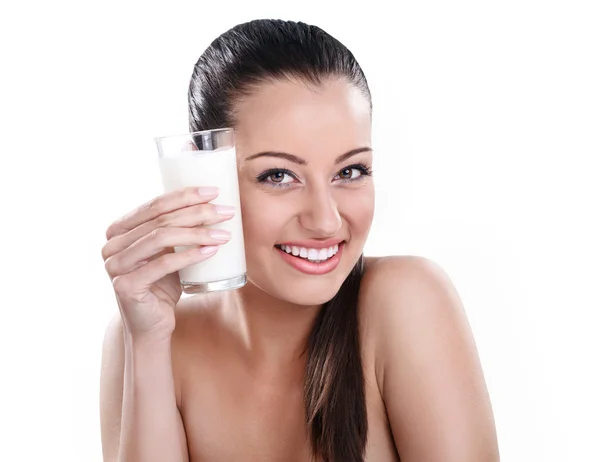 Beautiful woman toasts with milk — Stock Photo, Image