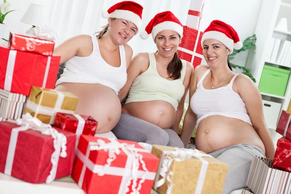 Pregnant women with Christmas gifts — Stock Photo, Image