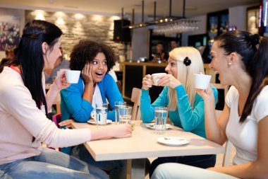 Friends enjoying in a cafe