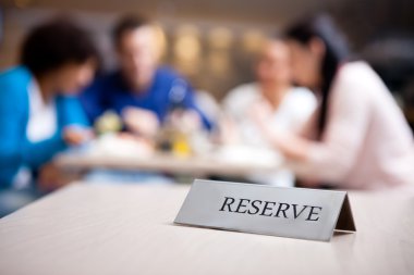 reserved table at nice restaurant clipart