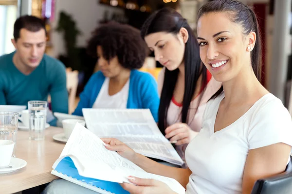 Female student with friends on — Stock Photo, Image