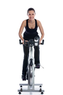 Woman doing spinning bike clipart