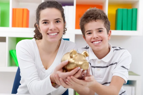 Children with piggybank — Stock Photo, Image