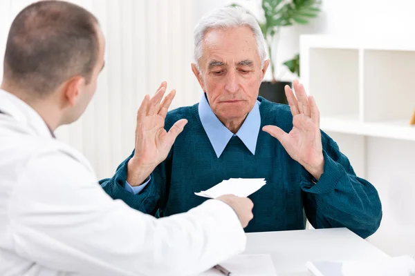 Shocked patient with prescription — Stock Photo, Image