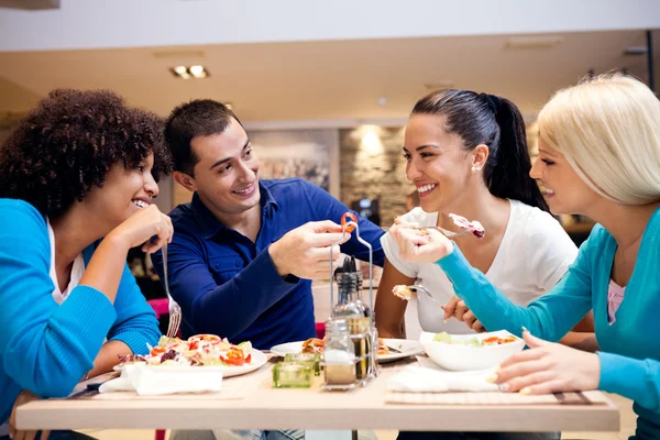 Happy teenagers having lunch — Stock Photo, Image