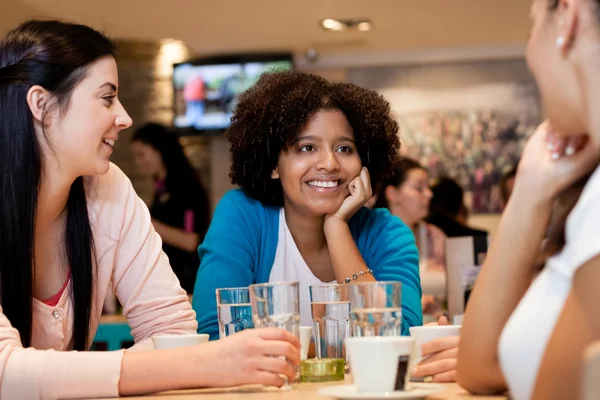 Teenagers girls in cafe Stock Picture