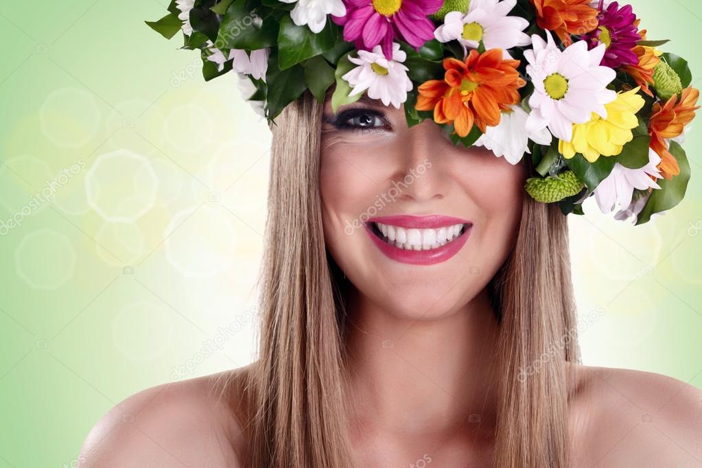 Smiling woman with flower wreath
