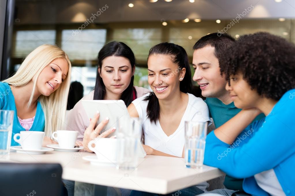 Group of young in modern cafe