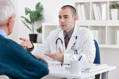 doctor explaining diagnosis to his patient clipart