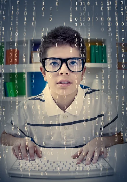 Concentrated little boy typing on keyboard — Stock Photo, Image